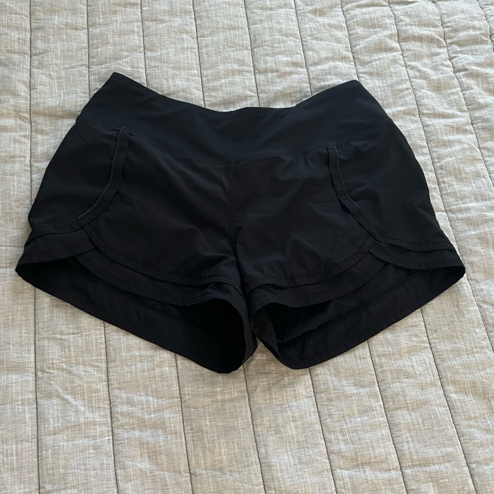 Women’s athletic shorts in black. Never worn. Size medium. Smoke free home.